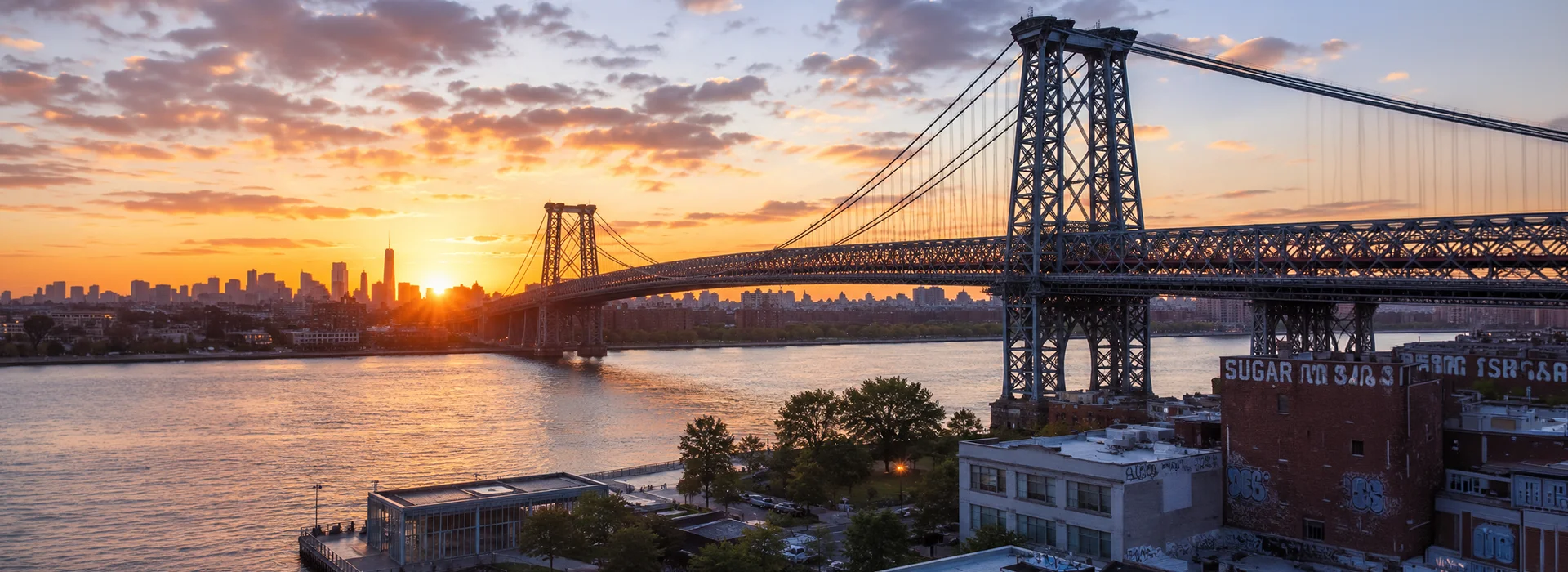 Panoramic view of the Williamsburg Bridge from Brooklyn at sunrise