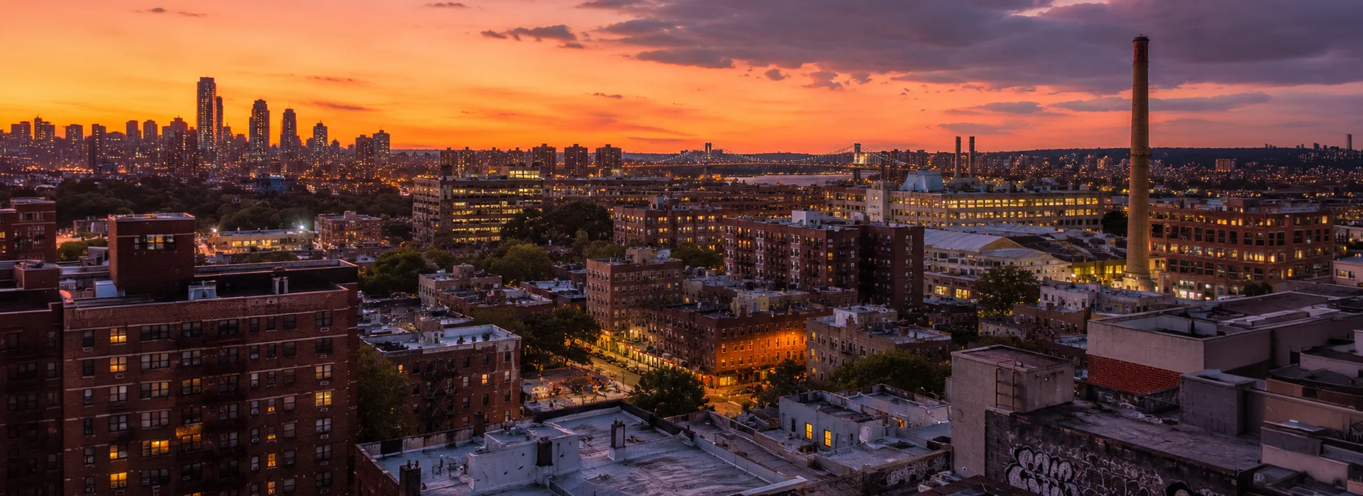 Panoramic view of the Bronx at sunset with residential and industrial buildings
